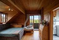 Ein Zuhause zum Wohlfühlen: Großzügiges Holzblockhaus mit Garten und moderner Haustechnik