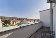 Moderne Dachgeschosswohnung mit großzügigen Terrassen in Mannersdorf für Anleger
