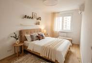stylische 55m² Dachgeschosswohnung | 2 Zimmer | 23m² Terrasse mit Süd-West Blick | Klimaanlage &amp; Außenjalousien