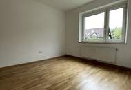 Wohnen im Einklang mit der Natur: modernisierte 2-Zimmer-Wohnung in Grünburg mit durchdachter Raumaufteilung und hochwertiger Bodensanierung! Entdecken Sie das volle Potential dieser Wohnung mit KI-gestützter Visualisierung!