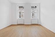 Küche mit schöner Fensterfront und Balkon in den ruhigen Innenhof, hell und freundlich!