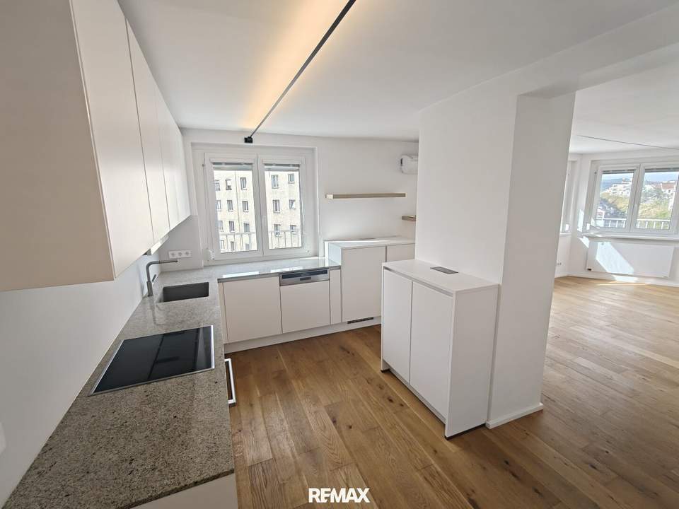 stylische 55m² Dachgeschosswohnung | 2 Zimmer | 23m² Terrasse mit Süd-West Blick | Klimaanlage & Außenjalousien