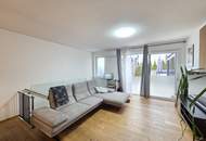 Neuwertige Eigentumswohnung mit Eigengarten sowie eine private Dachterrasse und zwei Garagenparkplätze.