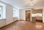 RUHELAGE NAHE JAKOMINIPLATZ | 2-Zimmer-Wohnung mit neuer Küche und Blick in den grünen Innenhof