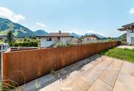 Modernes Wohnen mit Bergblick &amp; Sonnenterrasse – Hochwertige 2-Zimmer Gartenwohnung in Kössen