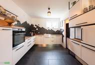 Neuwertige Gartenwohnung mit Terrasse und 2 Garagenplätze