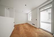 URBANER GARTENTRAUM! Hofseitiger Drei-Zimmer-Erstbezug nächst Schlossquadrat mit Terrasse und Eigengarten