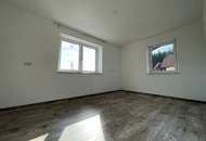 Mehrfamilienhaus mit Garage/Lager/Büro - Dorfwidmung