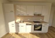 Geförderte Neubauwohnung mit Terrasse im 1. Stock