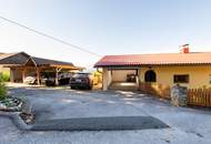 Einfamilienhaus mit Einliegerwohnung, Garage, Carports und Ausblick!