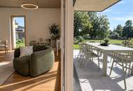 Velden am Wörthersee. **ERSTBEZUG** Eckgartenwohnung mit Grünblick und 2 Tiefgaragenplätzen, in perfekter Zentrumslage