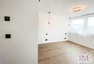 Hochwertig sanierte, sehr ruhige 2-Zimmer-Wohnung mit Balkon, Weitblick & Tiefgarage in Salzachnähe