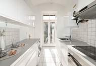 Altbau-Charme mit 3 Zimmern und Süd-Balkon in zentraler Lage