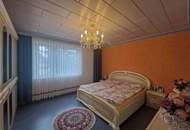 VIEL PLATZ BIETET DIESES HOCHWERTIGE WOHNJUWEL IN AUSGEZEICHNETER WOHNLAGE MIT INDOORPOOL, SAUNA, TRAUMHAFTEM WINTERGARTEN UND HERRLICHEM GARTEN SAMT ALTBAUMBESTAND