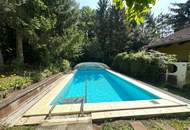 Großzügiges Einfamilienhaus mit Pool, Wintergarten und Doppelgarage mitten im Grünen!