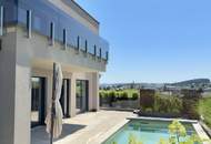 Zuhause ankommen: Traumhaus mit Salzwasserpool und moderner Gartengestaltung.