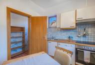 Kärntner Wohncharme in Seenähe – 5-Zimmer-Wohnung mit Kachelofen & Balkon