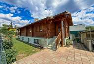 Chalet-Feeling mitten in Donaufeld - Naturstamm-Blockhaus mit Sauna, Kamin und Garten