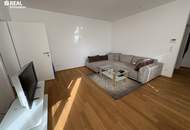 Neuwertige 2-Zimmer-Eigentumswohnung mit Kamin, Loggia und Garage