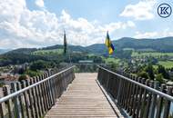 Zuhause im Grünen – Lichtdurchflutete Maisonette mit Gartenoase und Wasserblick