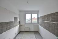 Sanierungsbedürftige Eigentumswohnung mit großzügiger Terrasse