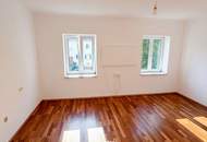 2-Zimmer-Mietwohnung mit 80 m² Eigengarten und PKW-Abstellplatz