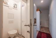 "Kaminfeuer trifft Gartentraum: Topmoderne Gartenwohnung im Wienerwald"