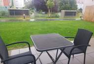 Moderne Gartenwohnung mit Terrasse in neuwertigem Wohnkomplex