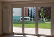 Moderne Gartenwohnung mit Terrasse in neuwertigem Wohnkomplex
