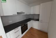 Gartenwohnung mitten in der Stadt! Karmeliterhof - Neubauwohntraum beim Rathausplatz