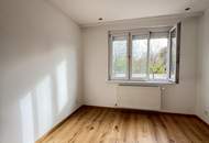 Erstbezug mit Augartenblick – Stilvolle 3-Zimmer-Wohnung mit durchdachtem Grundriss in zentraler Ruhelage