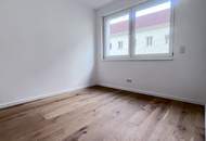 Renditestarke Anlegerwohnung an der U1 | Erstbezug | hofseitiger Balkon
