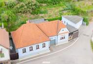 Gemütliches Einfamilienhaus mit grünem Innenhof, separatem Arbeitsbereich und Nebengebäude