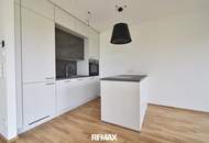 Exklusive Neubauwohnung mit moderner Küche, 37 m² Balkon und TG-Stellplatz in sonniger Lage!