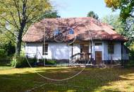 Einfamilienhaus in zentraler Bestlage mit Tennisplatz auf parkähnlichem Grund!