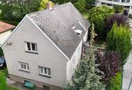 Großzügiges Haus mit zwei Wohnebenen, großem Garten und Garage – Renovierungsprojekt in guter Lage!
