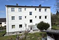 Renovierte-3-Raum-Eigentumswohnung mit Balkon und 203 m² Eigengarten