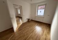 Exklusive Luxus-Singlewohnung in Steyr-Münichholz: frisch saniert, hochwertig ausgestattet, lichtdurchflutete Wohnräume und herrlicher Grünblick – inklusive Abstellraum, der sich ideal als Ankleidezimmer nutzen lässt!