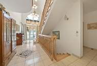 High-end living in a peaceful green location! A feel-good retreat in a class of its own: tradition meets state-of-the-art comfort!