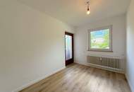 Wohnen im Grünen: Modernisierte Wohnung mit Balkon und neuer Einbauküche