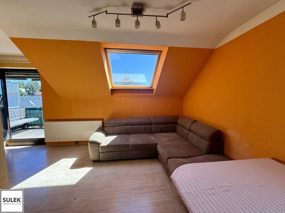 Perfekt geschnittene DG-Singlewohnung mit Terrasse und Garage in Wien Mauer