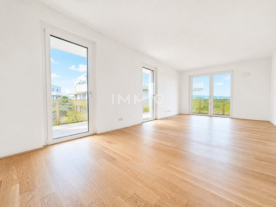 WOW-Balkon trifft Grünblick: 3-Zimmer-Erstbezug mit 28 m² Freifläche, Fußbodenkühlung & Geothermie