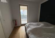 Neuwertige 2-Zimmer-Eigentumswohnung mit Kamin, Loggia und Garage