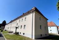 Herrlich sanierte Erdgeschosswohnung mit moderner Wohnküche, stilvollem Badezimmer und Grünblick - in ruhiger Siedlungslage mit ausgezeichneter Infrastruktur, ideal für kleine Familien!