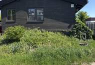 Urbanes Wohnen mit großem Garten mit kleinem Einfamilienhaus in Essling