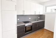 Moderne Neubauwohnung in mondäner Wohngegend mit Balkon