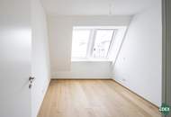 Ruhelage: Moderne DG-Wohnung mit Balkon und perfekter Anbindung