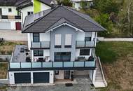 Modernes Einfamilienhaus mit großzügiger Terrasse und Doppelgarage