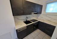 Barrierefreie Zweizimmerwohnung mit Eigengarten und Tiefgaragenstellplatz!