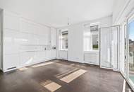 Weitblick, Ruhe & zentrale Lage – Sonnige Altbauwohnung mit Balkon